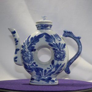 vintage donut shaped teapot in the chinoiserie style
